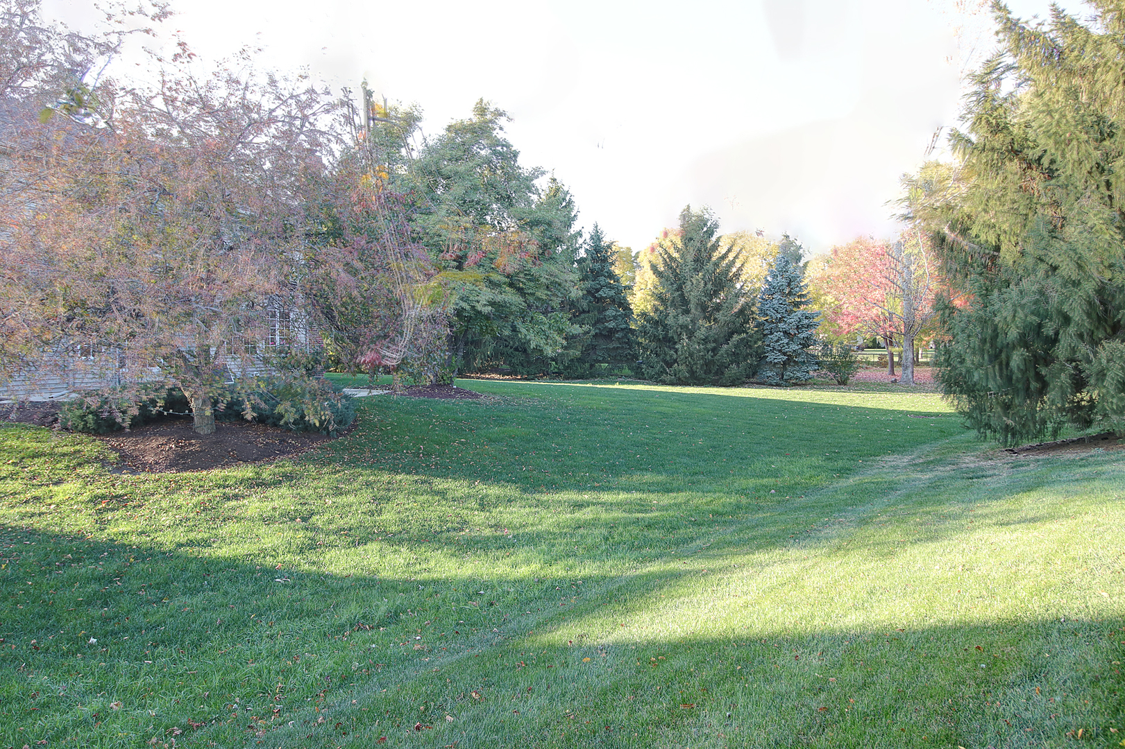26025 Whispering Woods Circle Plainfield, IL 60585 - Photo 42 of 43 a view of a golf course with a lake