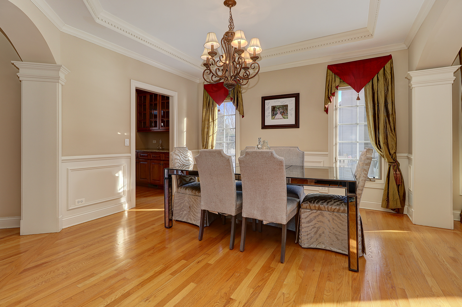 26025 Whispering Woods Circle Plainfield, IL 60585 - Photo 5 of 43 a view of a dining room with furniture wooden floor and chandelier