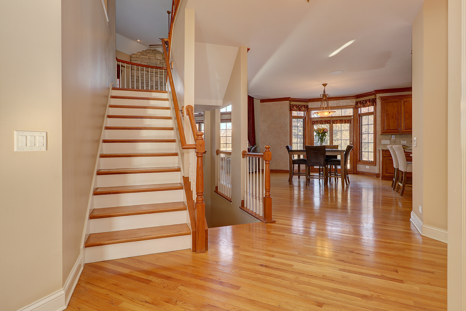 26025 Whispering Woods Circle Plainfield, IL 60585 - Photo 7 of 43 a view of entryway and hall with wooden floor
