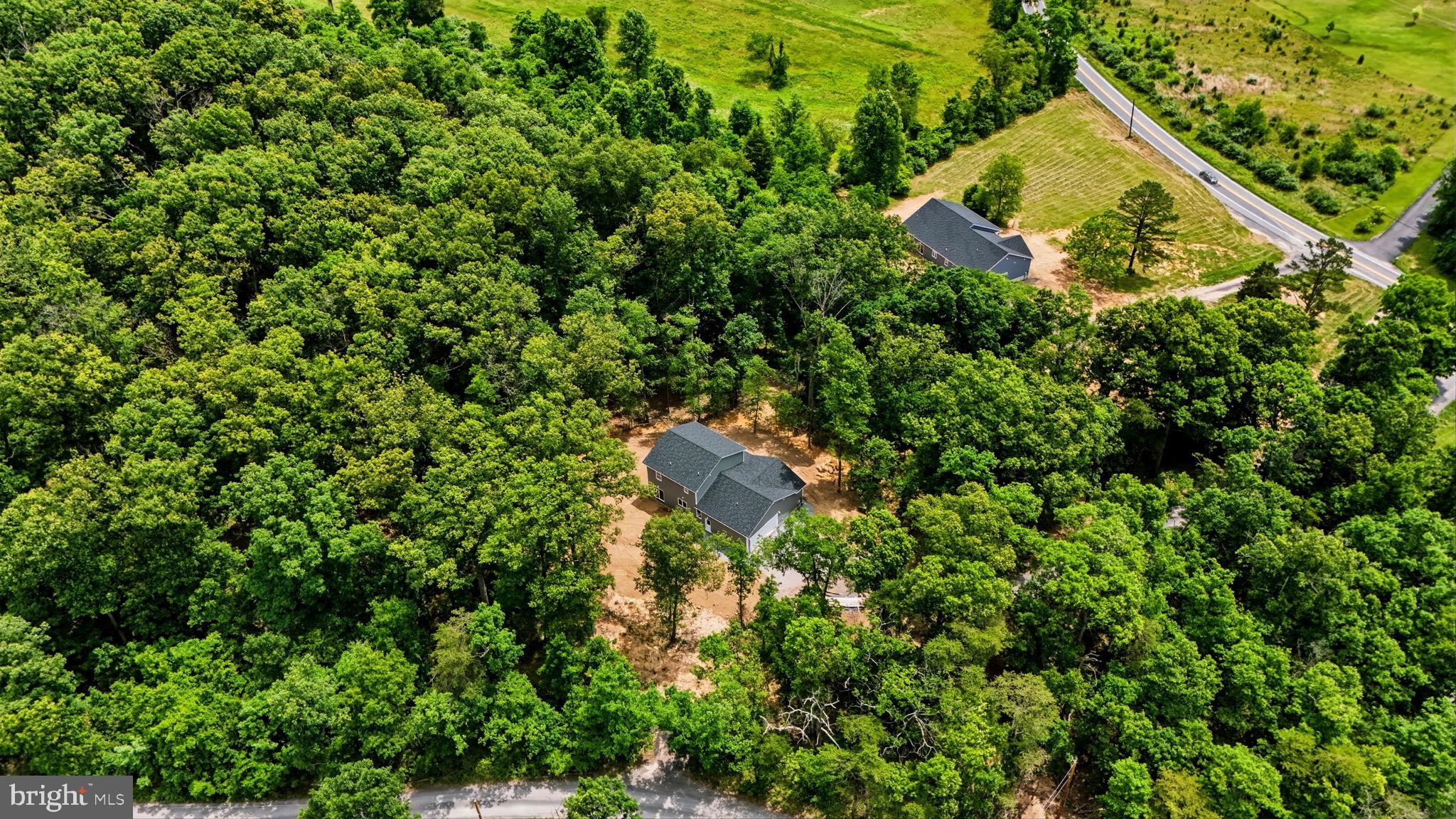 10339 Back Creek Valley Road Hedgesville, WV 25427 - Photo 46 of 48 an aerial view of a house with a yard and swimming pool