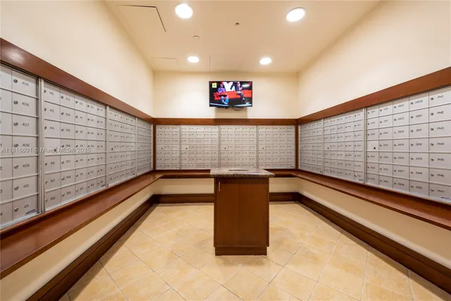 a view of a patio with table and chairs potted plants and a palm tree