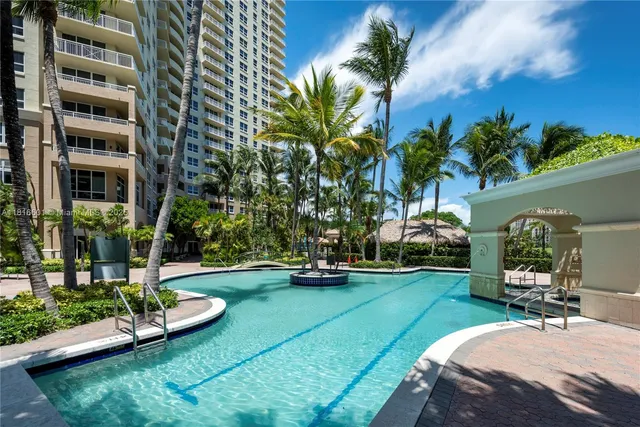 a view of a swimming pool with a patio