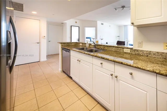 a large bathroom with a granite countertop sink and a mirror