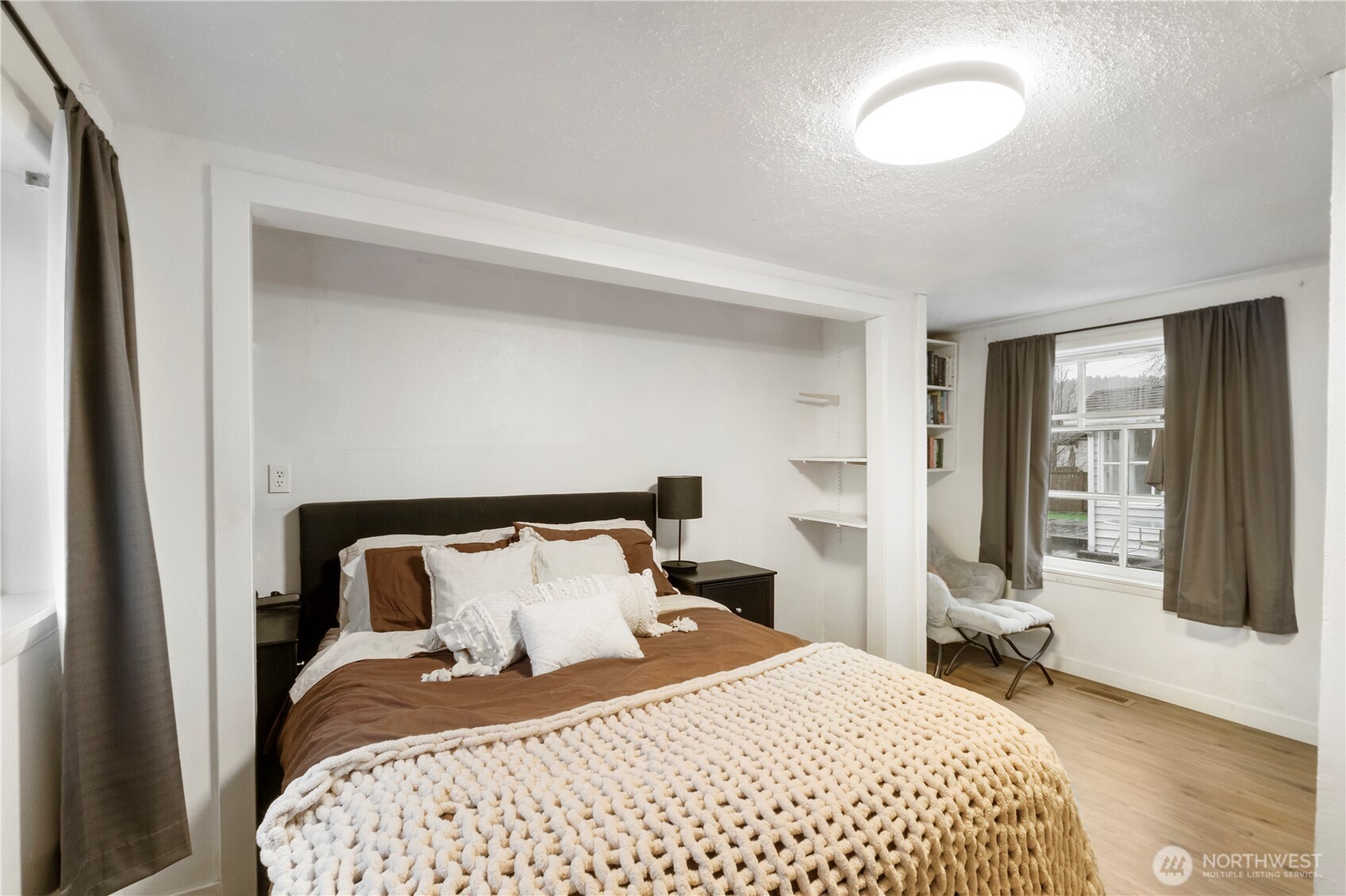 16419 92nd Street East Sumner, WA 98390 - Photo 12 of 39 a bedroom with a bed and wooden floor