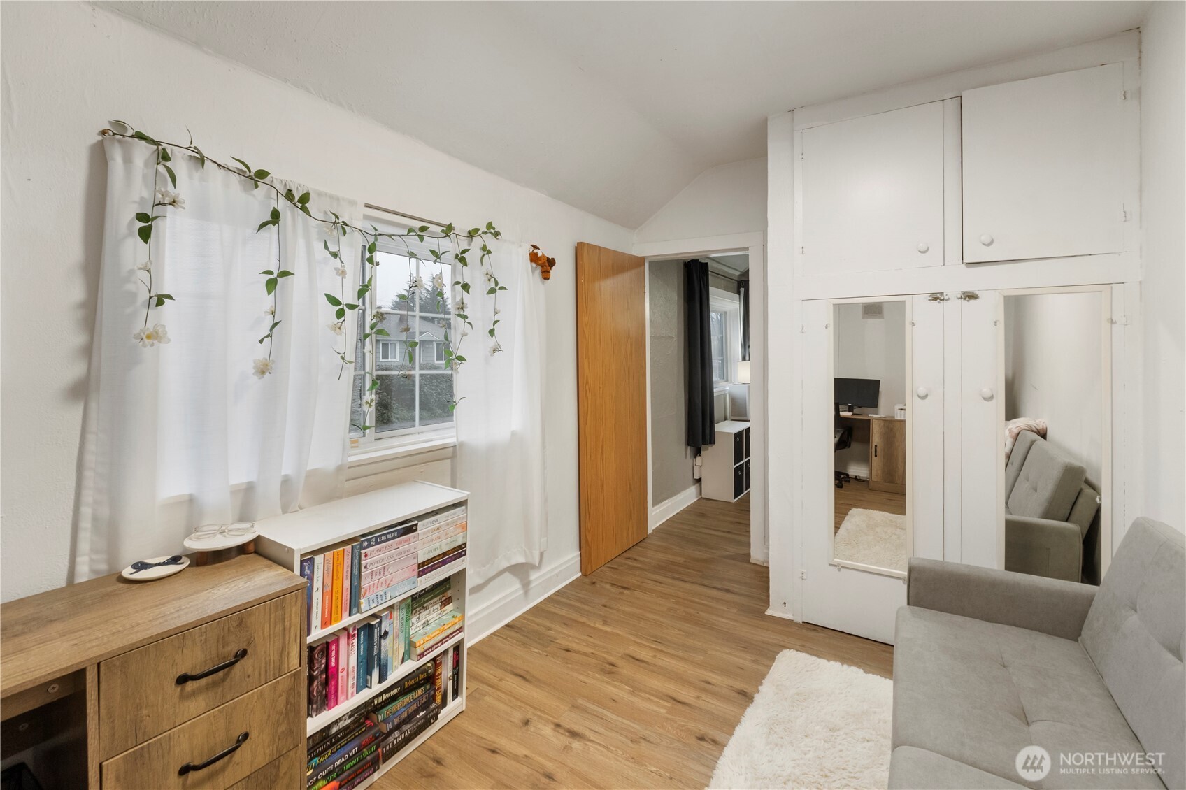 16419 92nd Street East Sumner, WA 98390 - Photo 15 of 39 a hallway with a baby crib and a wooden floor