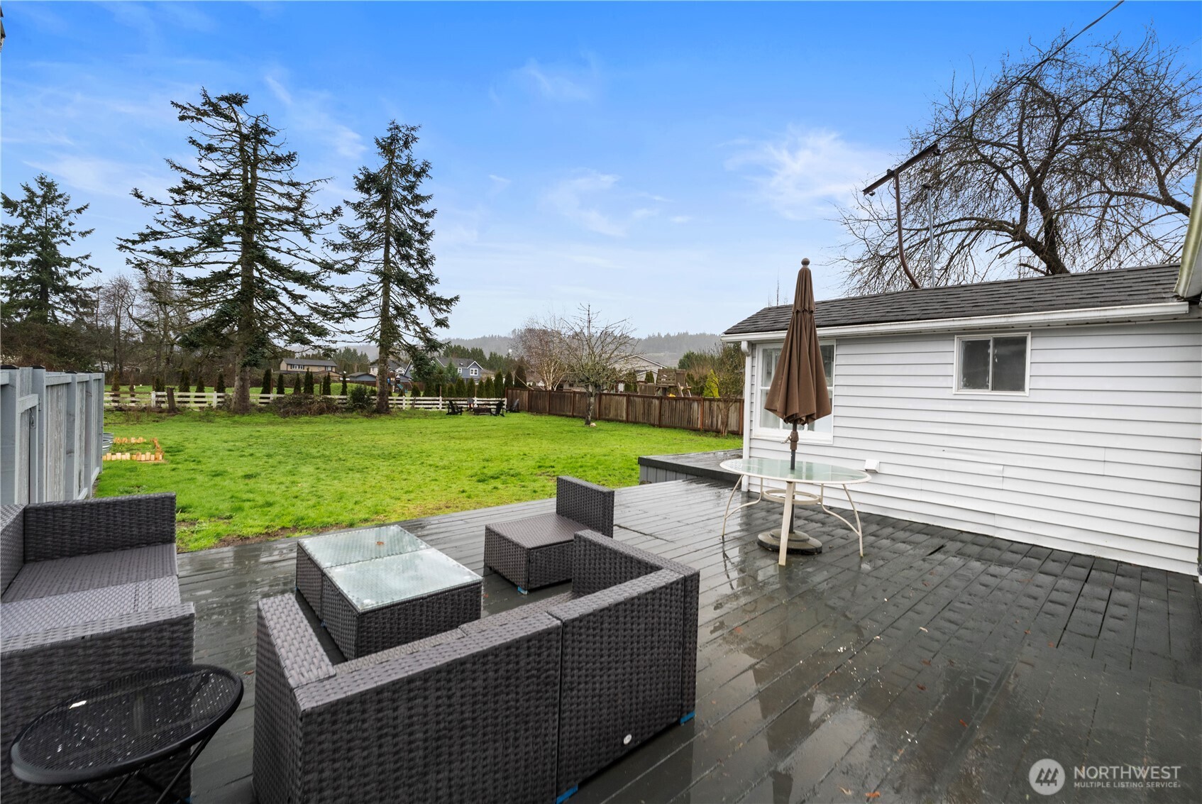 16419 92nd Street East Sumner, WA 98390 - Photo 22 of 39 a view of a patio with couches chairs and a yard