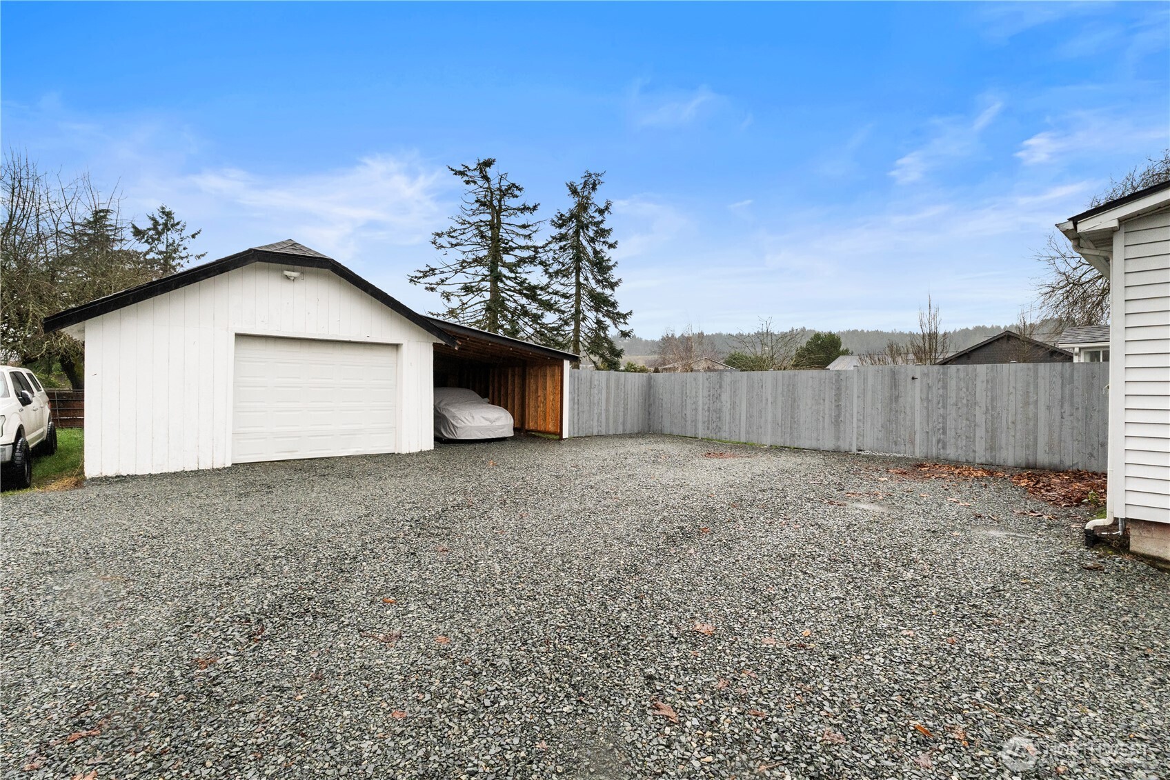 16419 92nd Street East Sumner, WA 98390 - Photo 26 of 39 a view of backyard of house with wooden fence