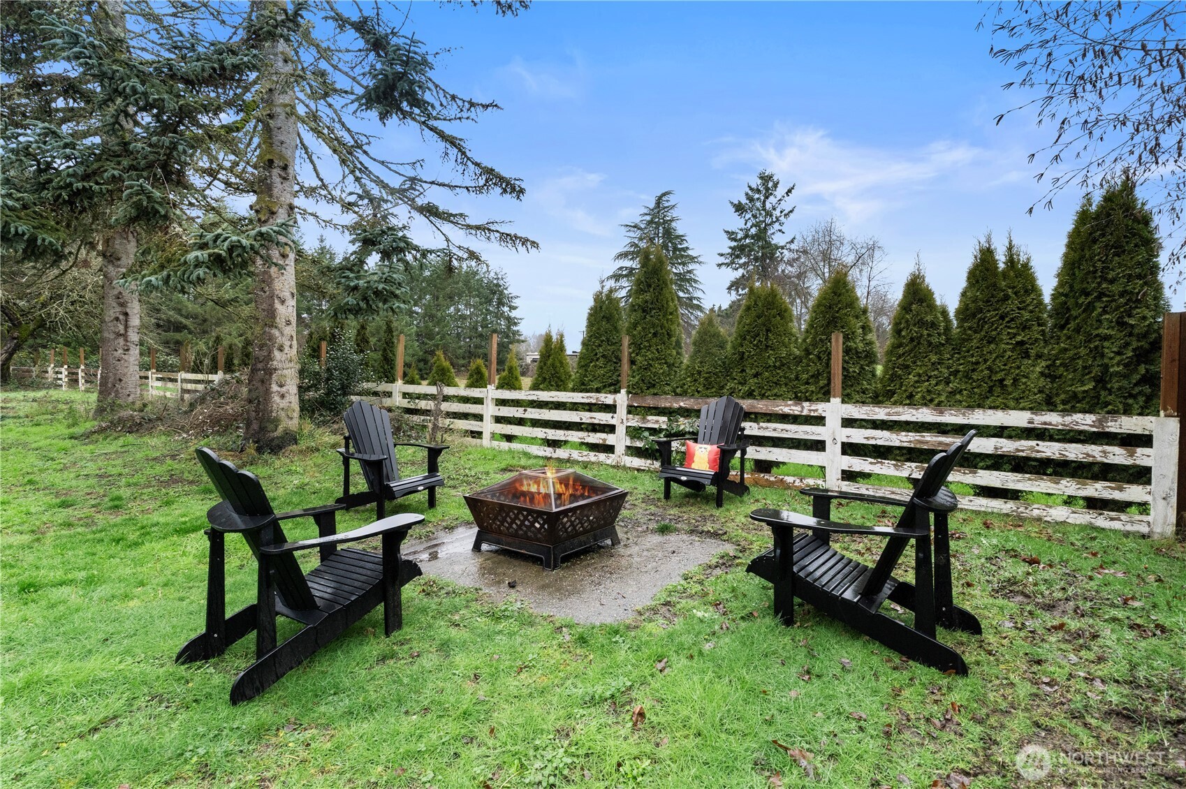 16419 92nd Street East Sumner, WA 98390 - Photo 31 of 39 a view of a bench in the garden near a lake