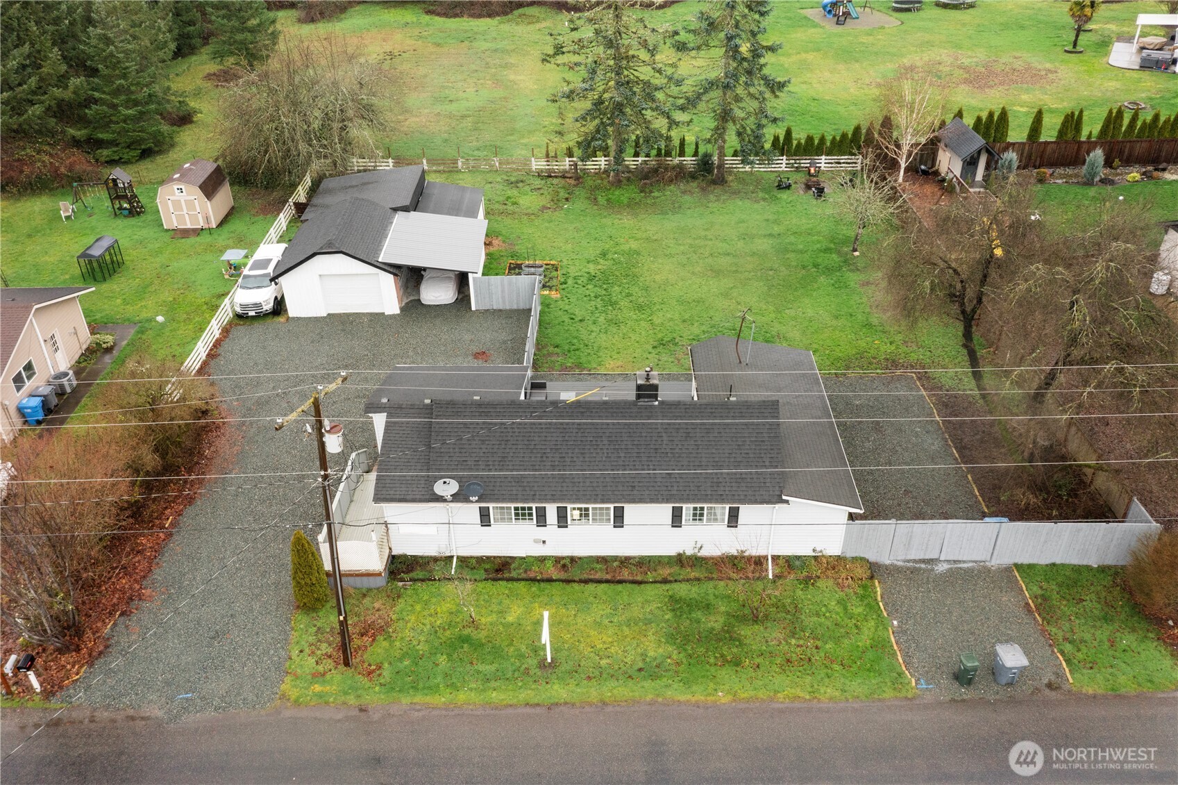 16419 92nd Street East Sumner, WA 98390 - Photo 39 of 39 an aerial view of a house with a garden and lake view