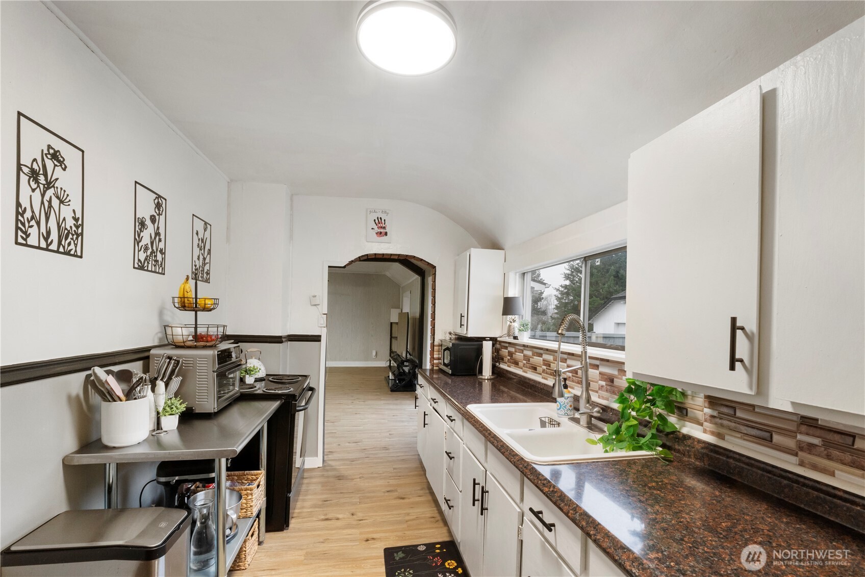 16419 92nd Street East Sumner, WA 98390 - Photo 9 of 39 a large kitchen with a table and chairs in it