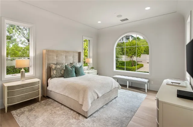 a kitchen with stainless steel appliances a white stove top oven and a wooden floors