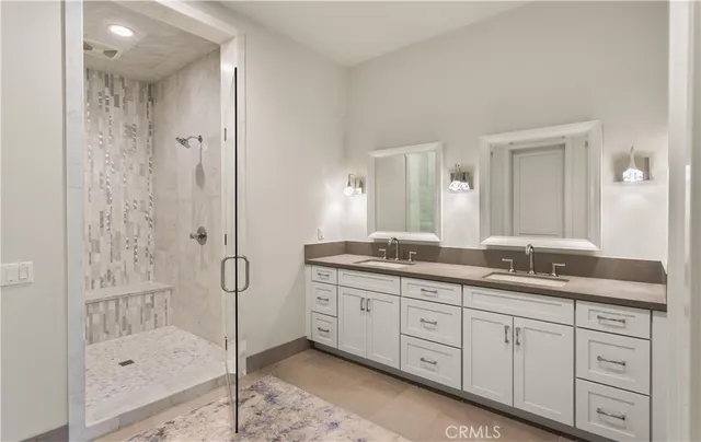 a kitchen with white cabinets and appliances
