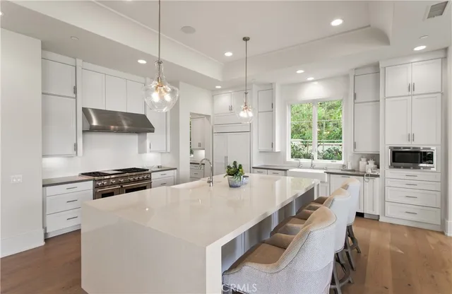 a living room with furniture a large window and a flat screen tv