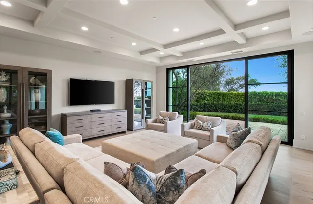 a view of a dining room with furniture large windows and wooden floor