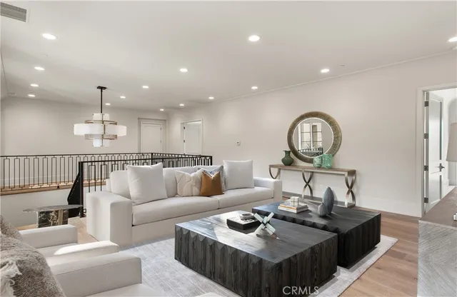 a spacious bedroom with a bed and large windows