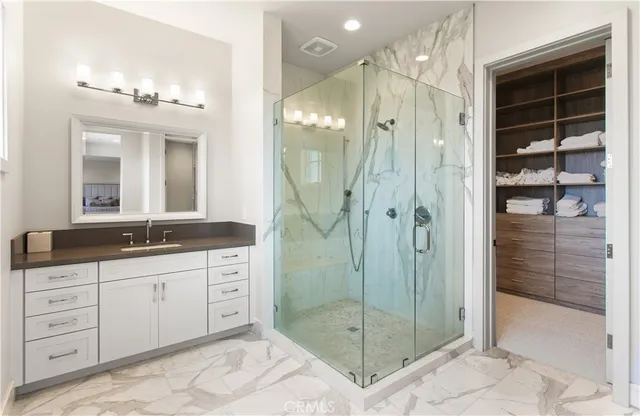 a bath room with a bath tub and shower