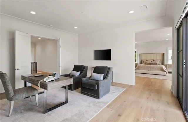 a spacious bedroom with a bed and a window