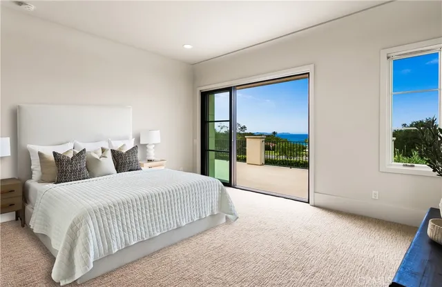 a bedroom with bed and a window