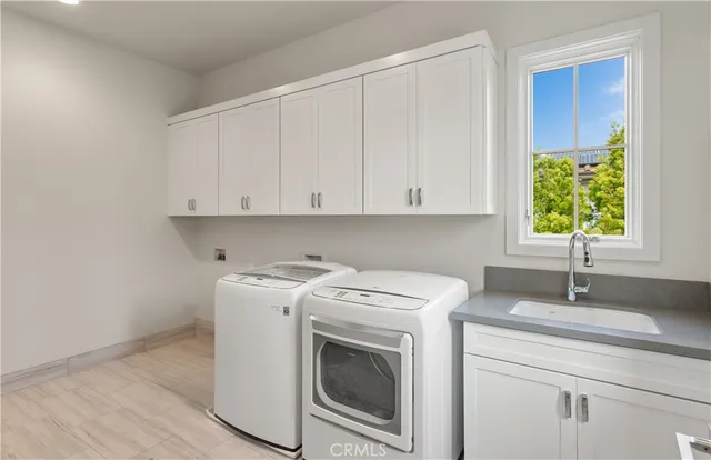 a kitchen with a stove and white cabinets