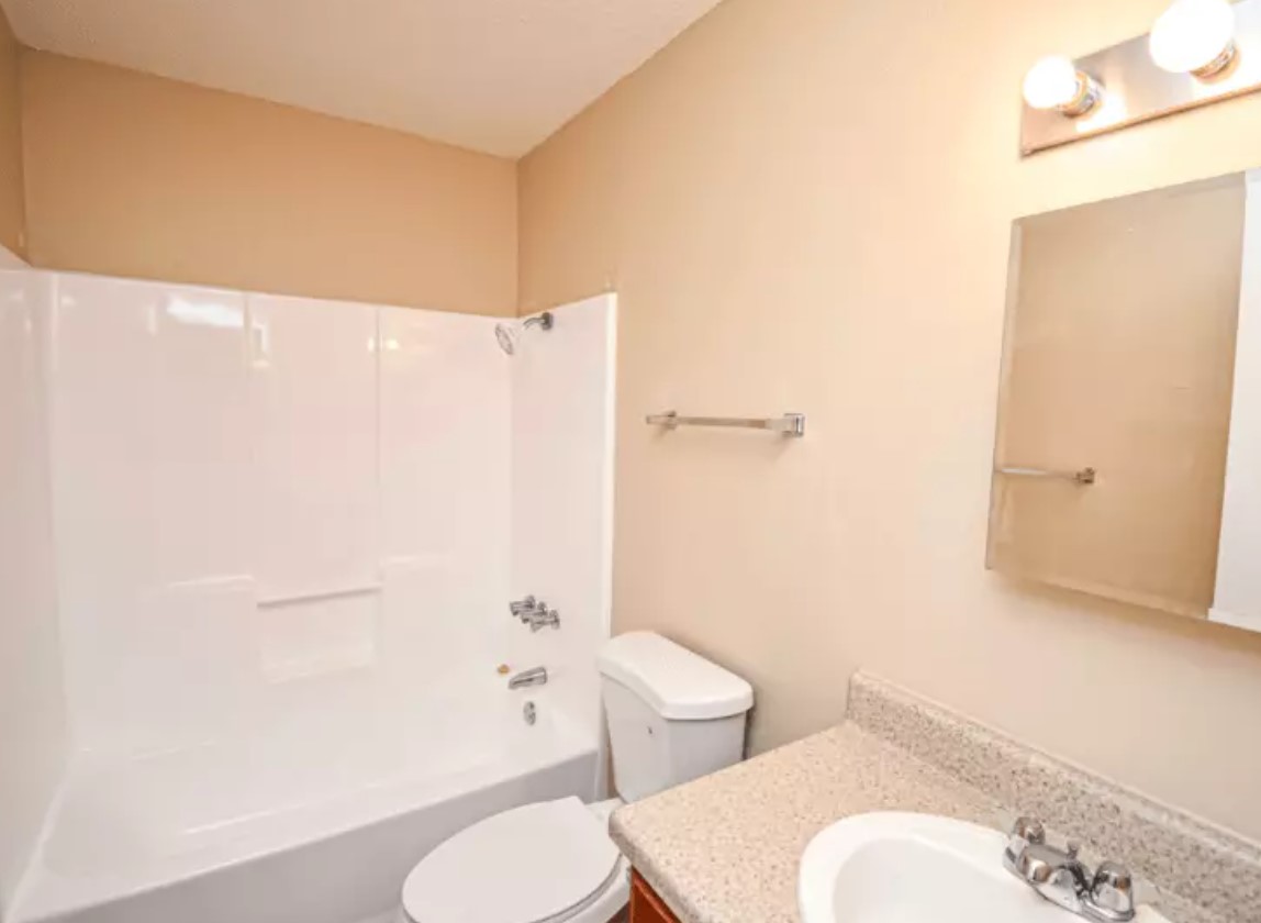 160 Gibson Road Athens, TX 75751 - Photo 11 of 11 a white toilet sitting next to a bathroom sink