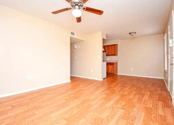 a view of a room with a ceiling fan