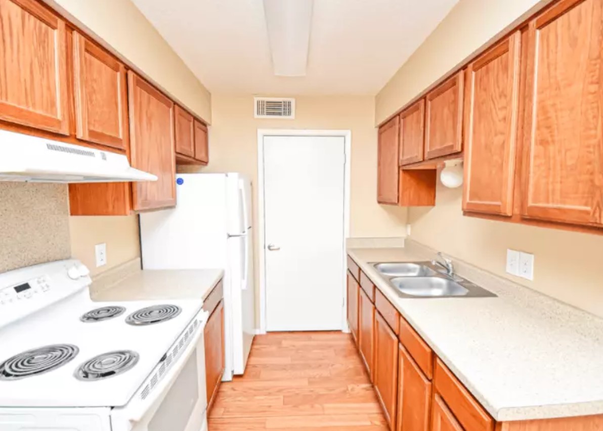 160 Gibson Road Athens, TX 75751 - Photo 8 of 11 a kitchen with a stove a sink and a refrigerator