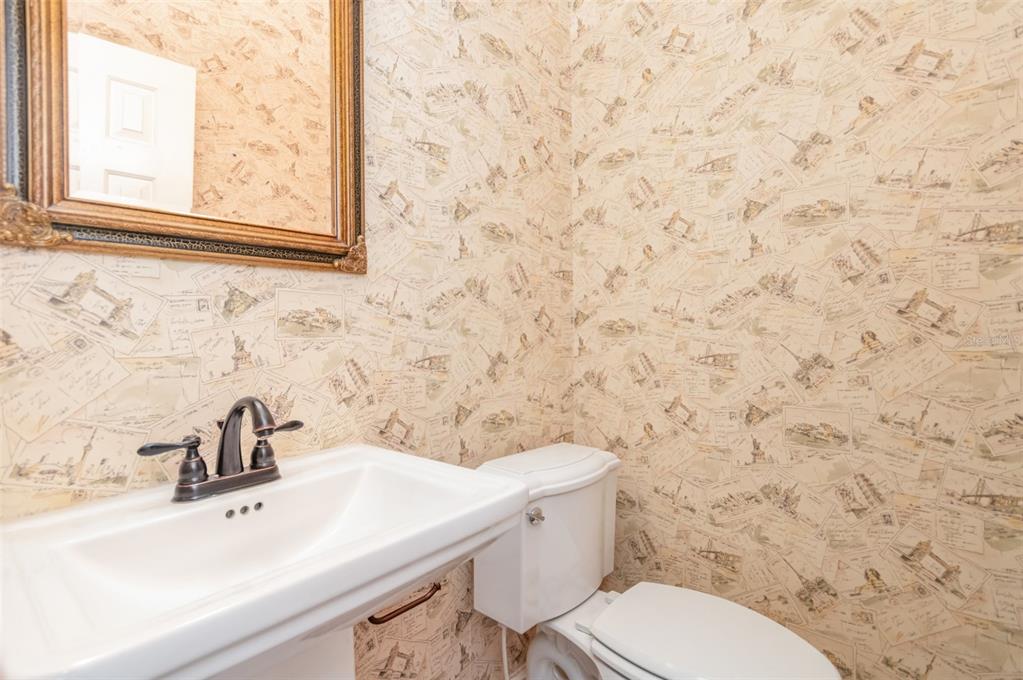 9217 Ridge Pine Trail Orlando, FL 32819 - Photo 15 of 39 a bathroom with a sink a toilet and a mirror