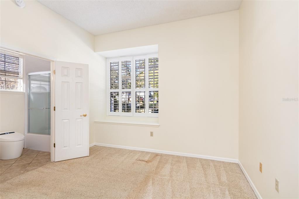 9217 Ridge Pine Trail Orlando, FL 32819 - Photo 28 of 37 a view of an empty room with a window