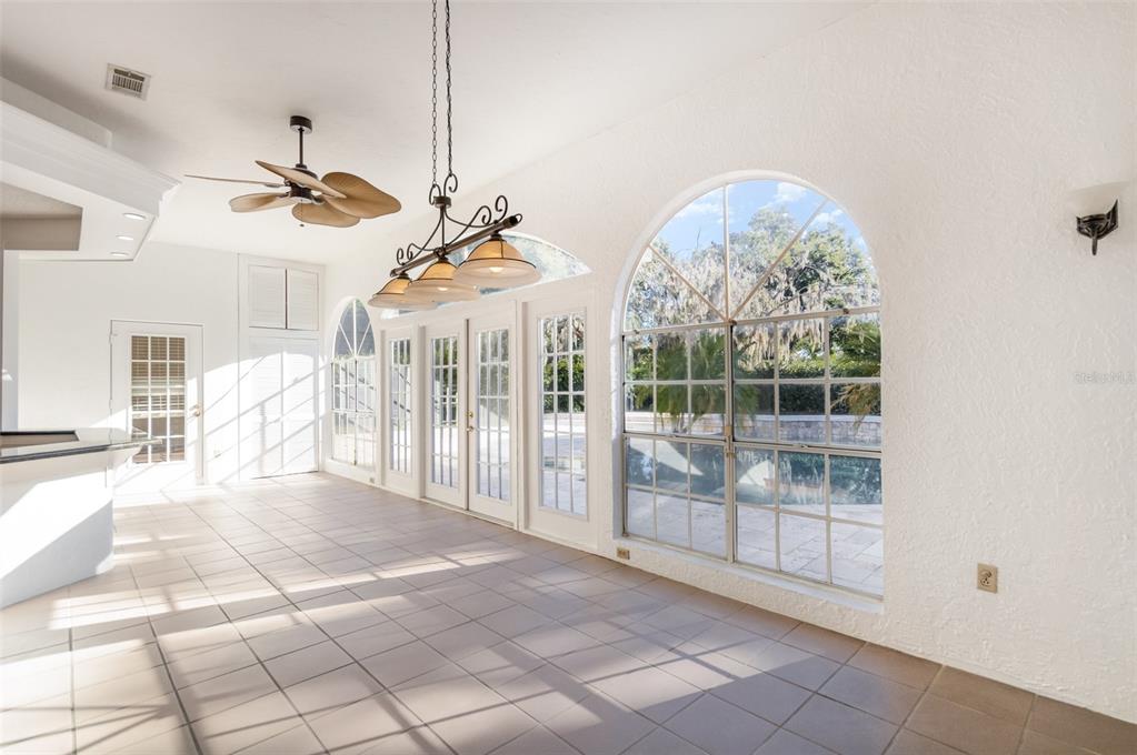 9217 Ridge Pine Trail Orlando, FL 32819 - Photo 30 of 39 a view of a living room and chandelier fan