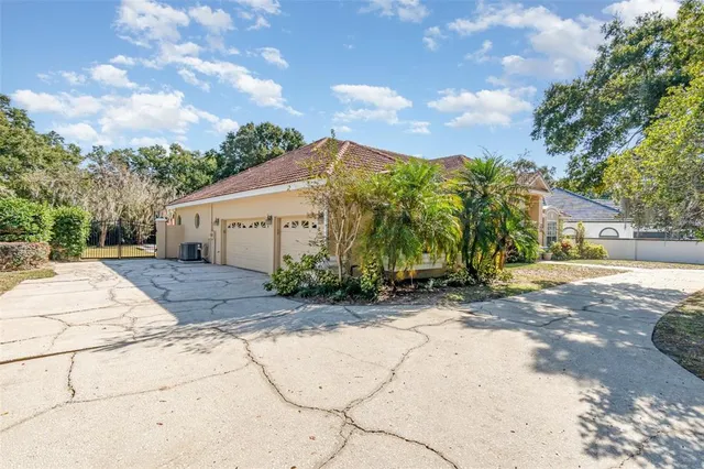 a view of a house with palm trees