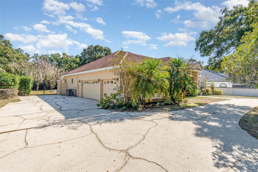 9217 Ridge Pine Trail Orlando, FL 32819 - Photo 32 of 37 a view of a house with palm trees