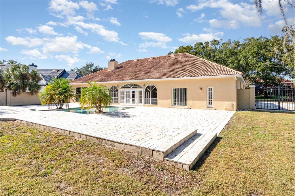 9217 Ridge Pine Trail Orlando, FL 32819 - Photo 35 of 37 a house with trees in the background