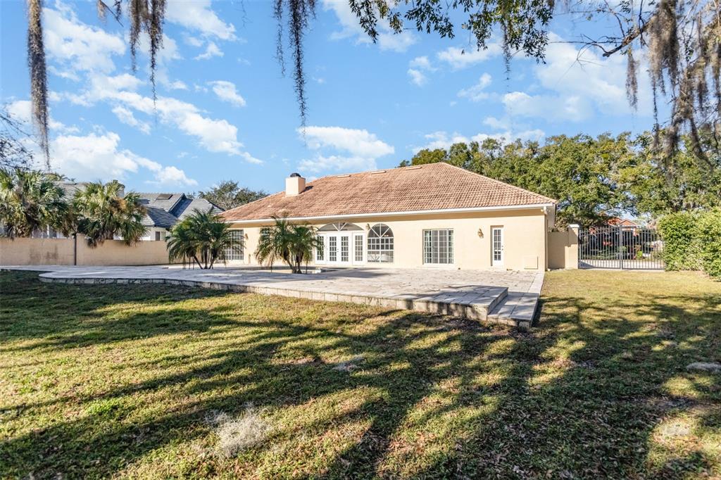 9217 Ridge Pine Trail Orlando, FL 32819 - Photo 36 of 37 a front view of a house with a yard