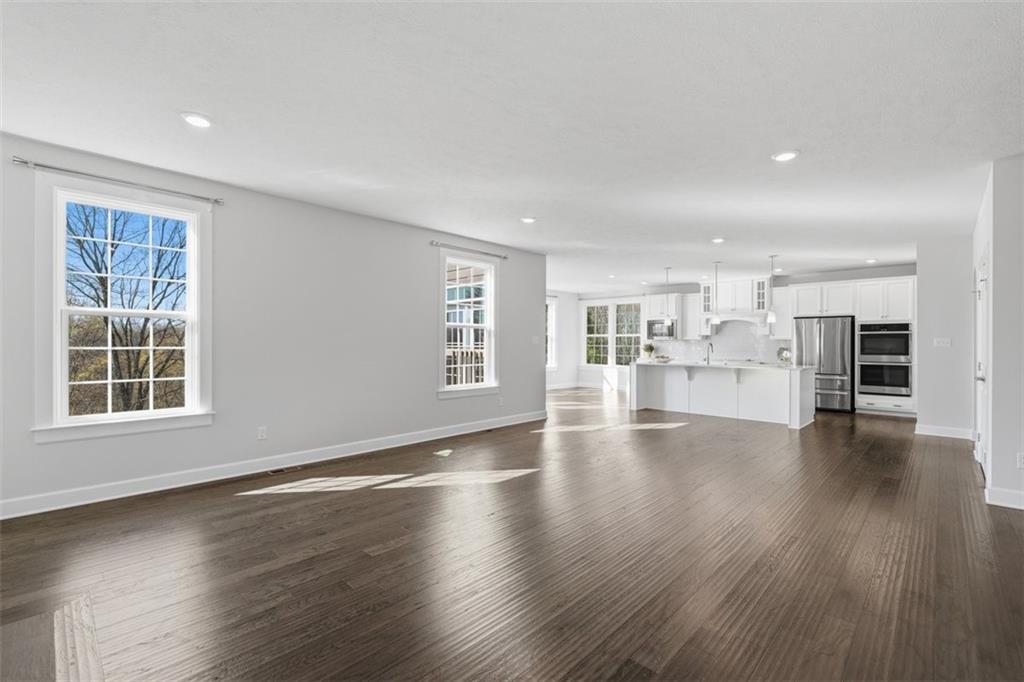 641 Tullamore Trail Mars, PA 16046 - Photo 12 of 47 an empty room with wooden floor and windows