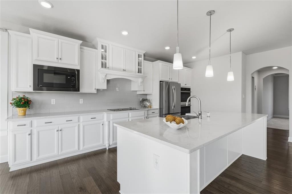641 Tullamore Trail Mars, PA 16046 - Photo 15 of 47 a kitchen with white cabinets and stainless steel appliances