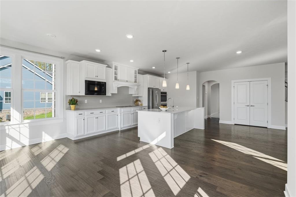641 Tullamore Trail Mars, PA 16046 - Photo 21 of 47 a large white kitchen with a stove a sink and a refrigerator
