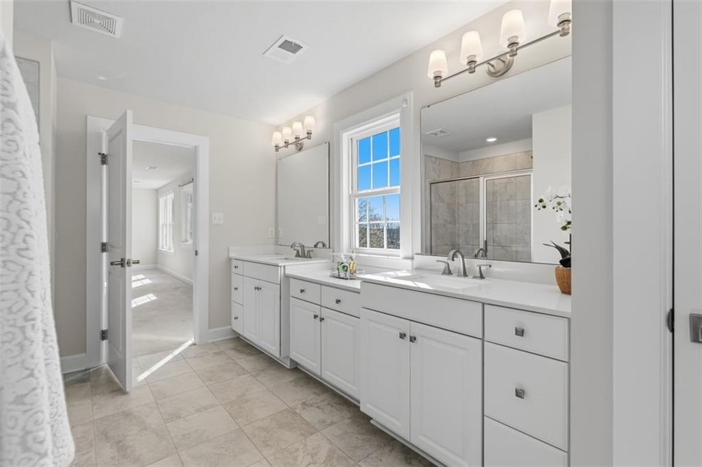 641 Tullamore Trail Mars, PA 16046 - Photo 28 of 47 a spacious bathroom with a double vanity sink mirror and double