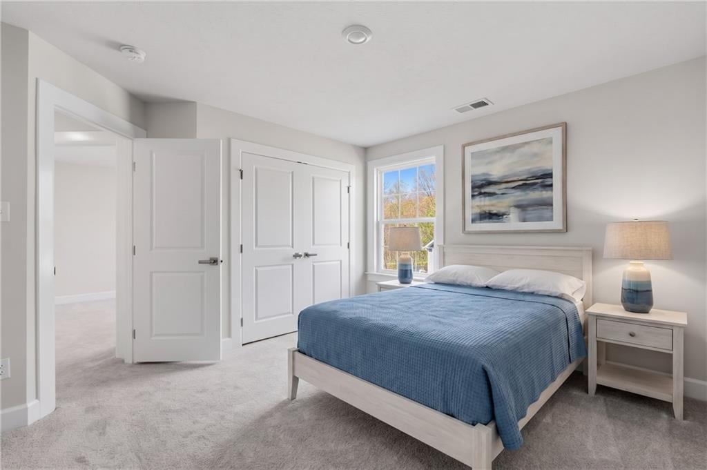 641 Tullamore Trail Mars, PA 16046 - Photo 32 of 47 a bedroom with a bed and a lamp on dresser