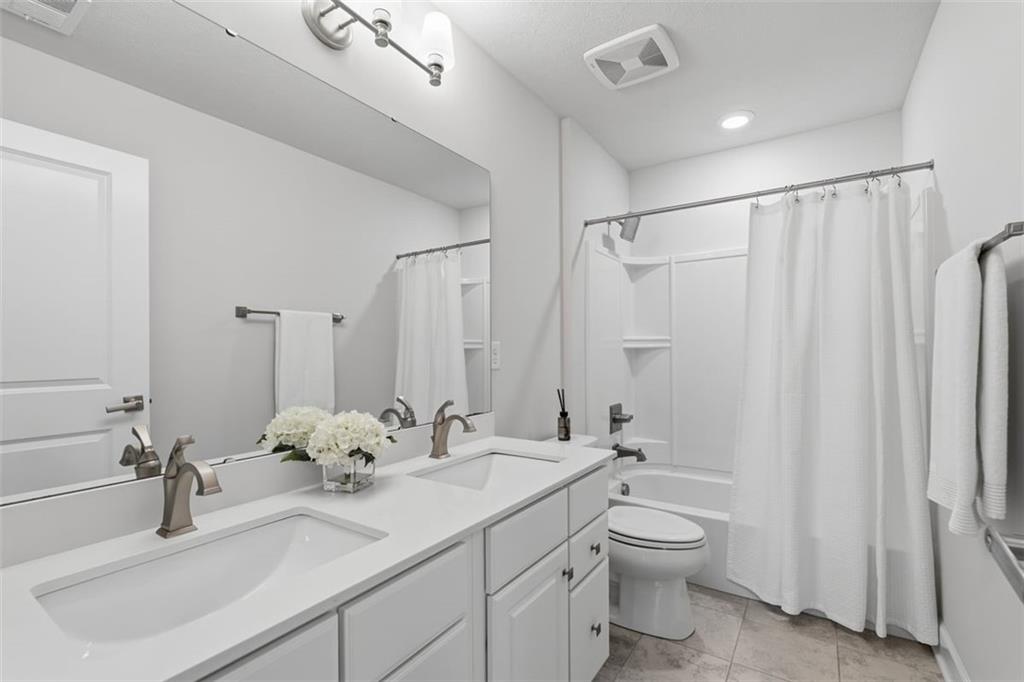 641 Tullamore Trail Mars, PA 16046 - Photo 34 of 47 a bathroom with a double vanity sink toilet and a mirror
