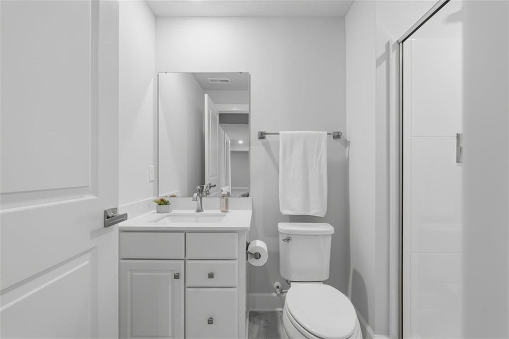 641 Tullamore Trail Mars, PA 16046 - Photo 38 of 47 a bathroom with a toilet sink vanity and mirror