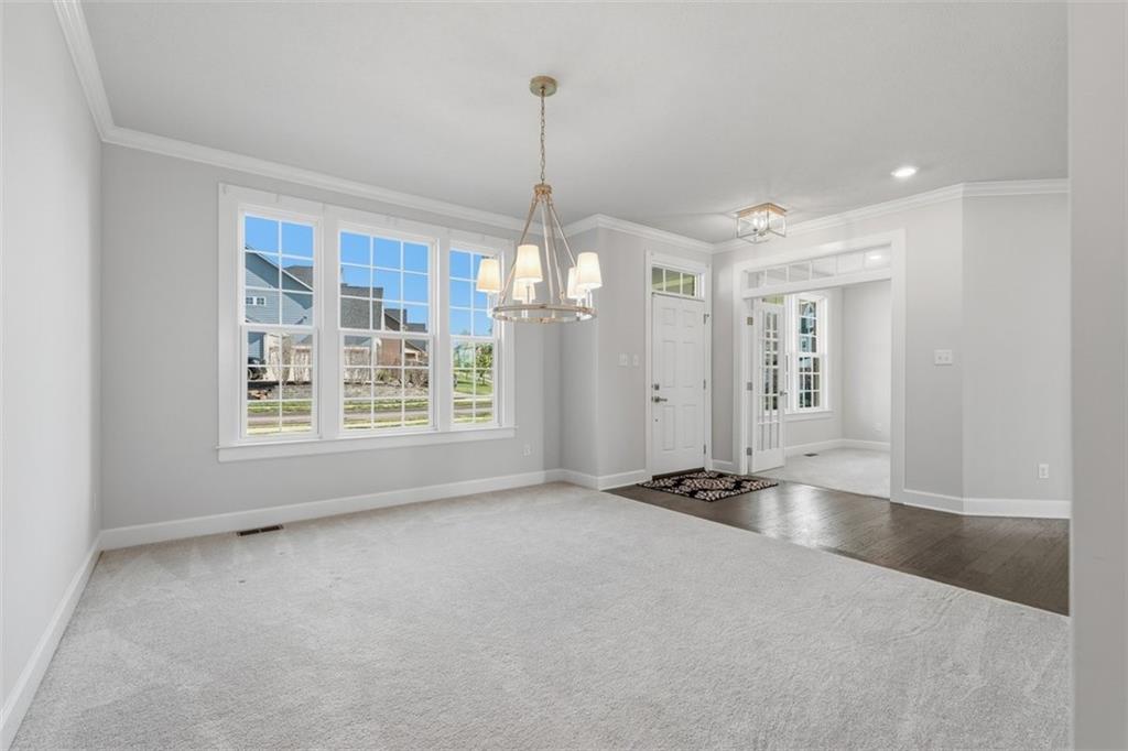641 Tullamore Trail Mars, PA 16046 - Photo 7 of 47 a view of an empty room with glass door and windows