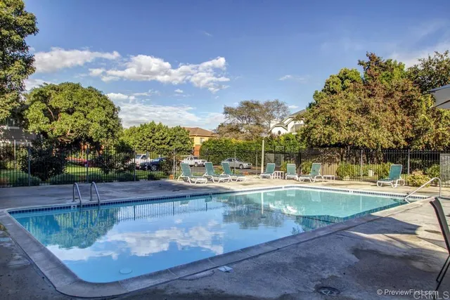 a view of a swimming pool with a patio