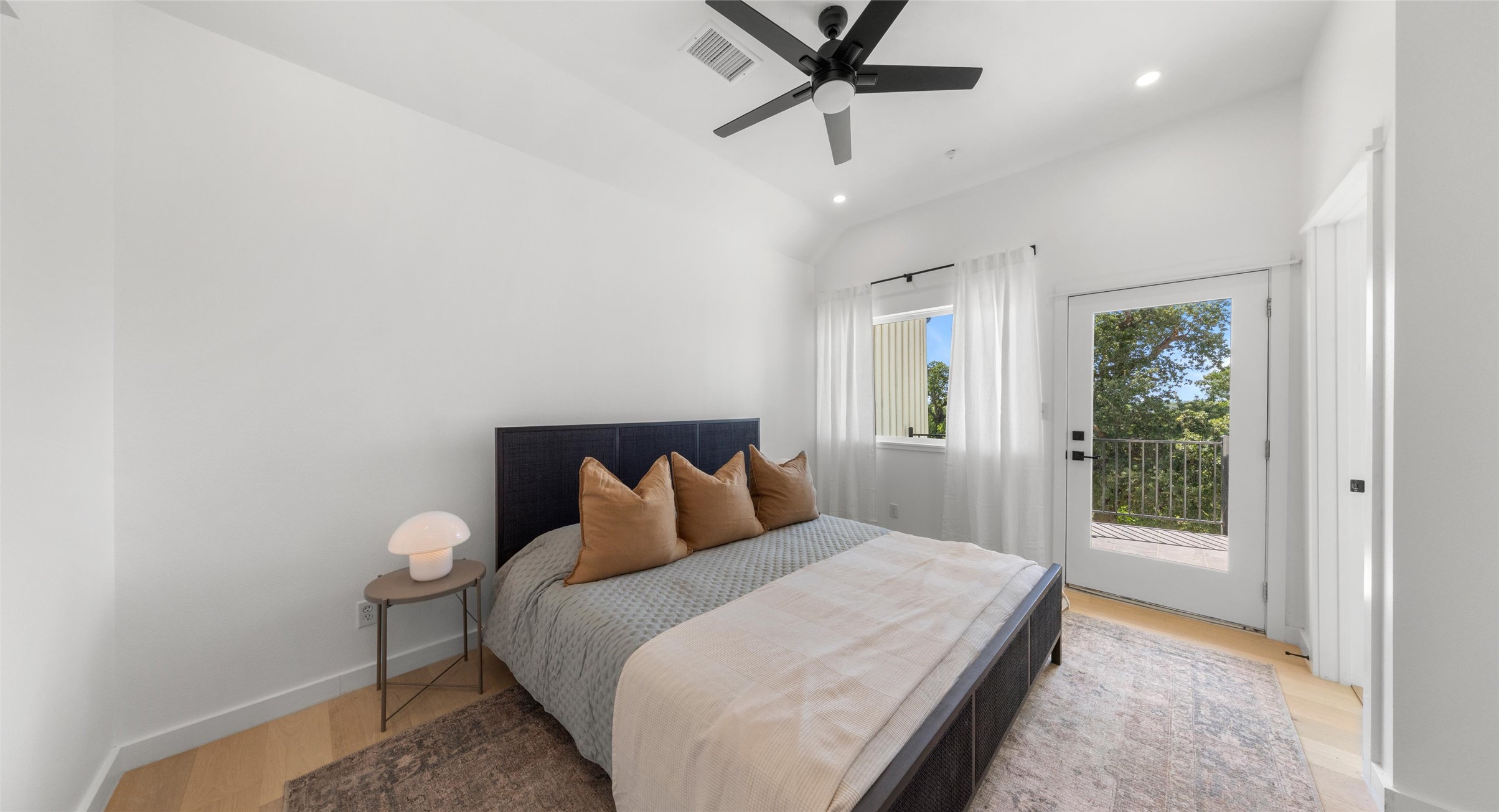 5912 Harold Court, Unit 107 Austin, TX 78721 - Photo 23 of 35 A vaulted-ceiling primary suite that feels open and serene — a true retreat to recharge in. Model No. 105 Shown.