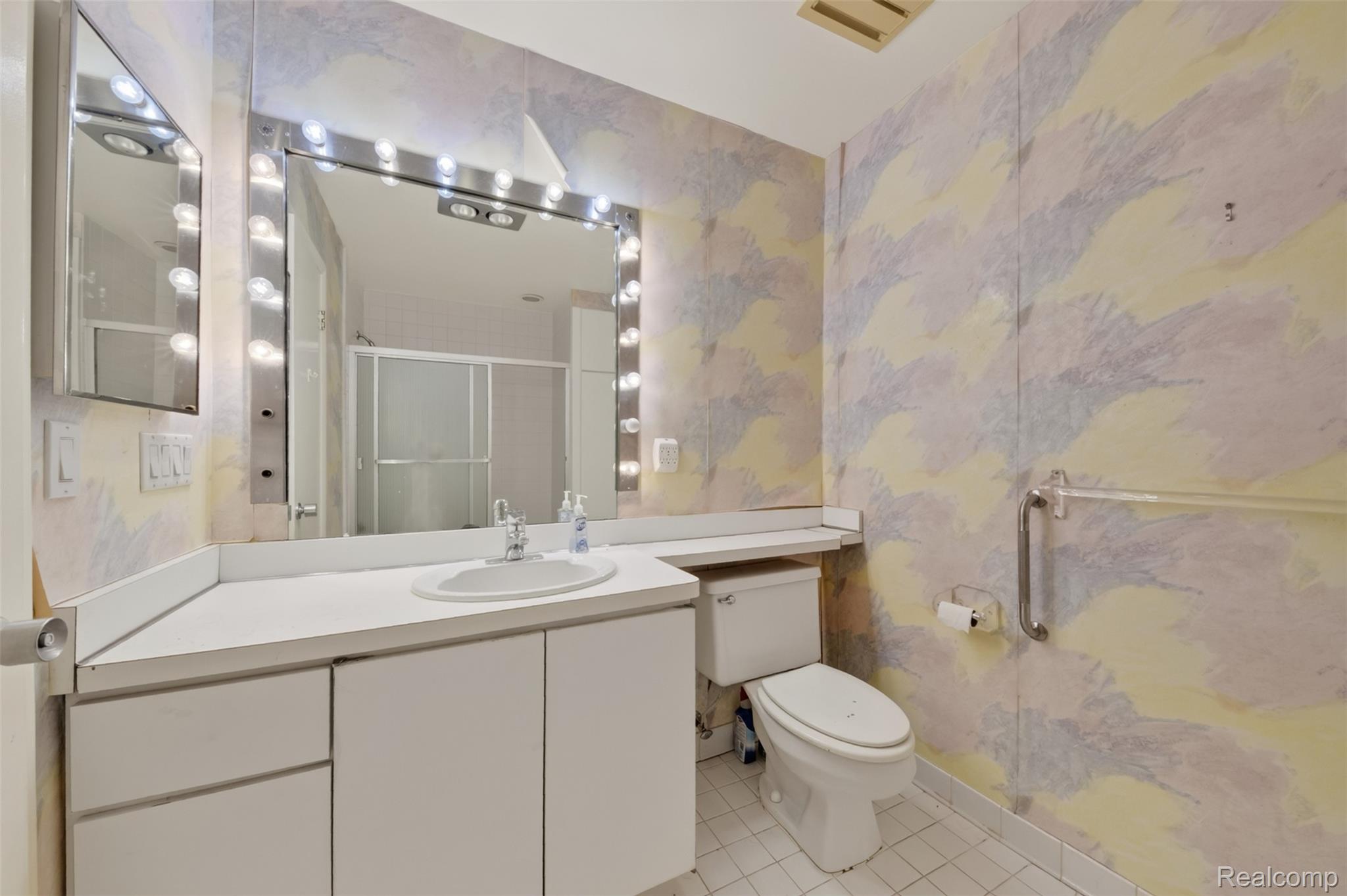 31915 West 14 Mile Road Farmington, MI 48334 - Photo 38 of 47 Modern bathroom featuring a floating vanity with rectangular vessel sink, quartz countertop, and chrome faucet