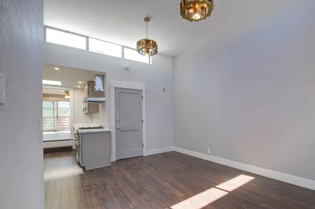 a kitchen that has a sink and a stove