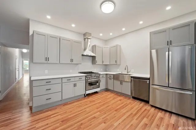 a view of kitchen with cabinets and outdoor space