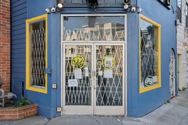 a view of a balcony with lots of wooden furniture