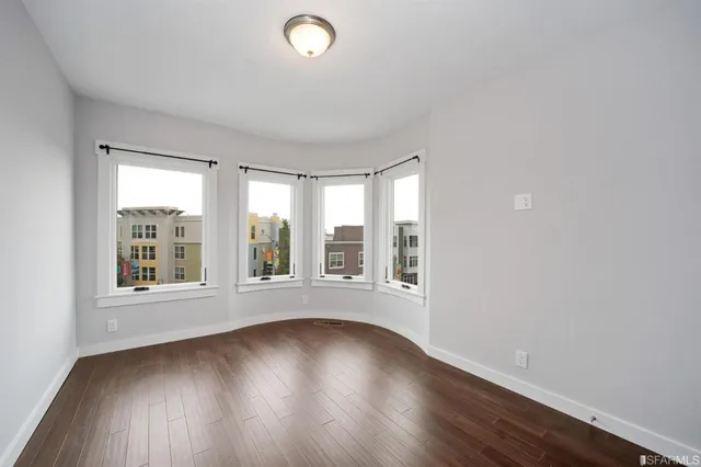 a kitchen that has a sink a stove and a table