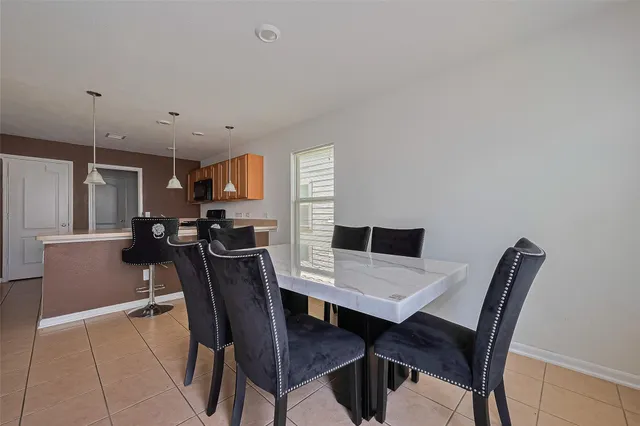 a view of a dining room with furniture