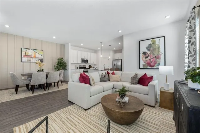 a living room with furniture and a rug